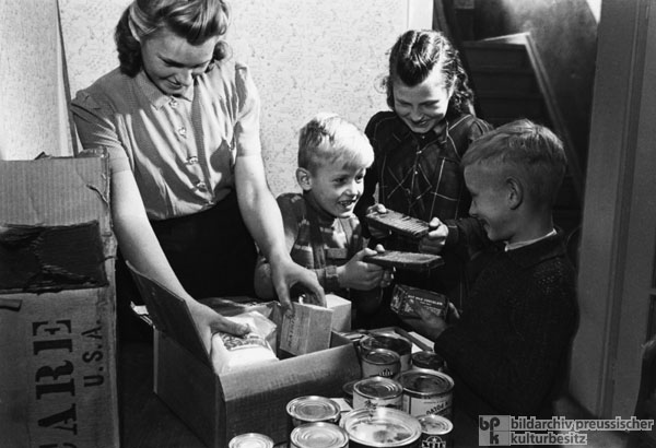 Opening a CARE Package (1948)